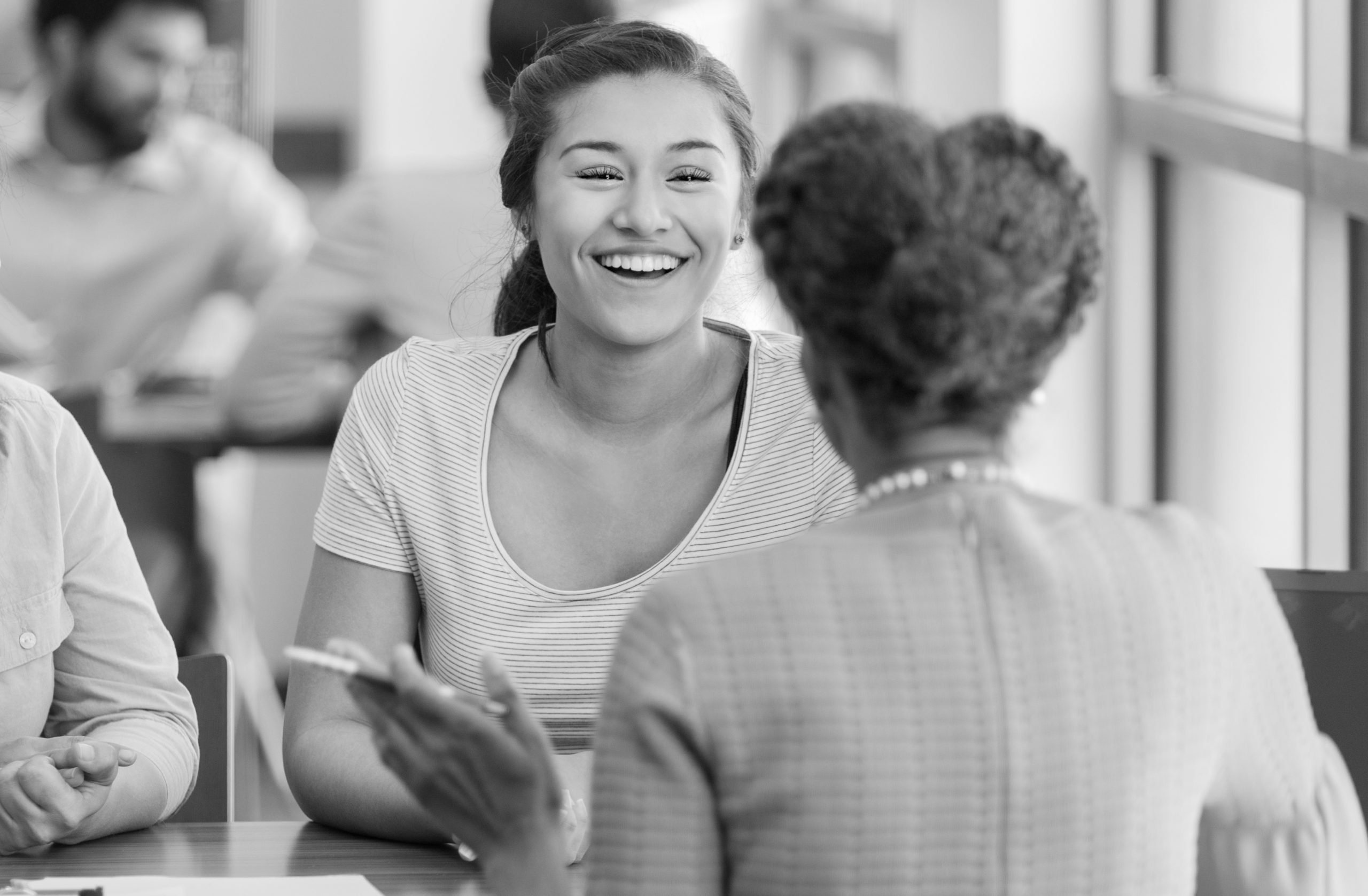 Loan officer discusses student loan with college student