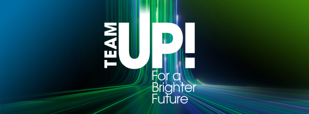 Black design with bright blue and green lights running vertically up the graphic, hexagonal text bubbles, and white text: “TeamUp! For a Brighter Future | Inspire, Aspirations in Computing; Engage, Teach Engineering; Empower Counselors for Computing”