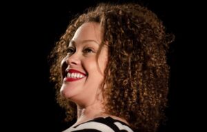 Suzi Q. Smith smiling and looking to the left