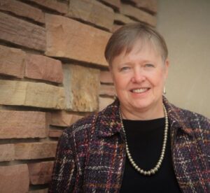 A headshot of Sandra Laursen smiling at the camera